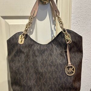 Michael Kors Jet Set coated canvas with leather trim Large Shoulder Bag.